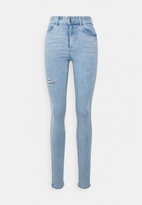 Jeans skinnies azul claro feitos de denim, com cintura alta, fecho de botão e detalhes desgastados nas pernas. Tecido texturizado.