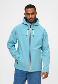 Ljusblå, huva jacka med hel dragkedja, snörning och två framfickor. Tyget ser slätt och något blanka ut.