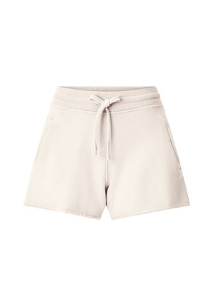 Beige cotton shorts with ribbed elastic waistband, front drawstring, side pockets, and raw edge hems.