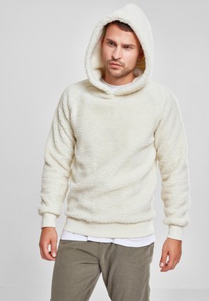 Kremfarget hettegenser laget av myk, teksturert fleece med vid hals, ribbestrikkede mansjetter og snorhette.