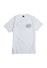 White cotton T-shirt featuring a black "DEUS" logo on the left chest, short sleeves, and a classic crewneck design.