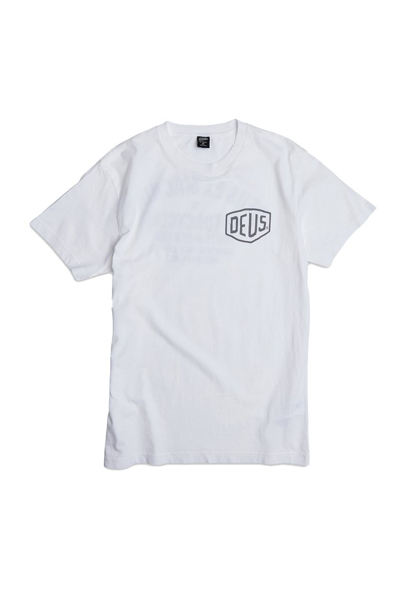 White cotton T-shirt featuring a black "DEUS" logo on the left chest, short sleeves, and a classic crewneck design.
