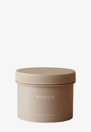 Récipient rond beige avec couvercle à vis portant l'étiquette Waphyto Body Cream Balance sur un fond blanc uni.
