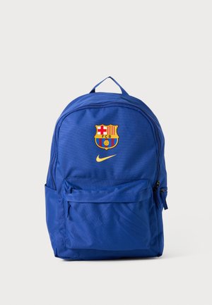 Blue backpack with a zippered main compartment, front pocket, featuring the FC Barcelona logo and Nike swoosh. Made of durable fabric.