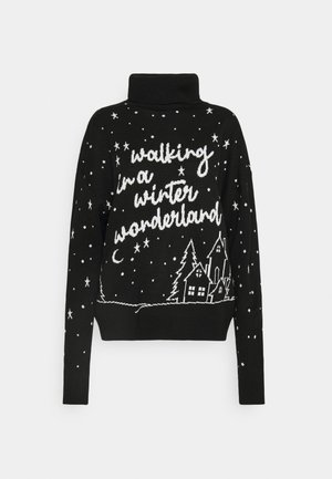 Suéter de cuello alto negro con texto blanco "walking in a winter wonderland", estrellas, media luna, árboles de hoja perenne y patrón de tres casas.