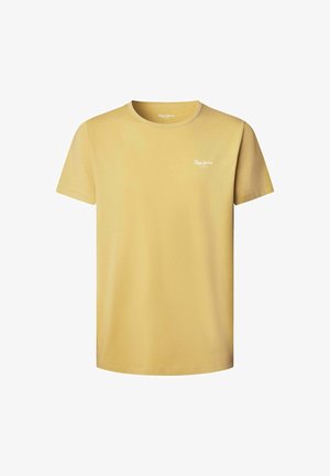 Koszulka z krótkim rękawem, okrągłym dekoltem w jasnym żółtym kolorze z bawełny, z małym białym logo na górnej lewej części klatki piersiowej. Miękka, gładka tekstura.