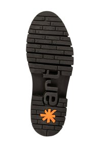 Suela de zapato de goma negra con patrones de tracción horizontales y verticales, con "ab" grabado y un diseño de estrella naranja cerca del talón.
