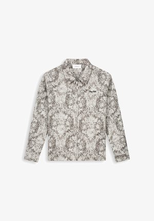 Vesten met lange mouwen en ritssluiting, met kraag, grijs-wit abstract patroon en kleine zwarte geborduurde tekst op de linkerborst.