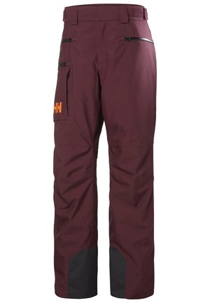 Bordeauxkleurige skibroek met een verstelbare tailleband, ritszakken en zwarte accenten bij de uiteinden. Gemaakt van weerbestendig materiaal.