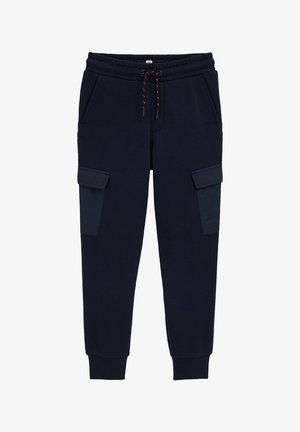 Pantalon de survêtement cargo bleu marine avec taille élastique, cordon de serrage, poches sur les côtés et poignets resserrés. Fabriqué en tissu doux et durable.