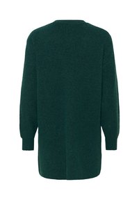 Lång, oversized grön tröja med ribbad textur. Har en rund halsringning och sänka axlar, med en rak baksida och utan knäppningar.