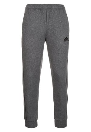 Szare spodnie dresowe Adidas z elastycznym pasem, ściągaczami przy kostkach, bocznymi kieszeniami i czarnym logo Adidas na lewym udzie, prezentowane na białym tle.