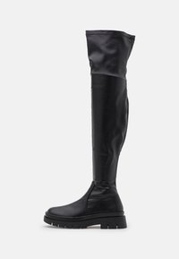 Bottes noires cuissardes en matériau synthétique lisse. Caractérisées par une semelle épaisse et une coupe ajustée, sans éléments métalliques ni accents visibles.