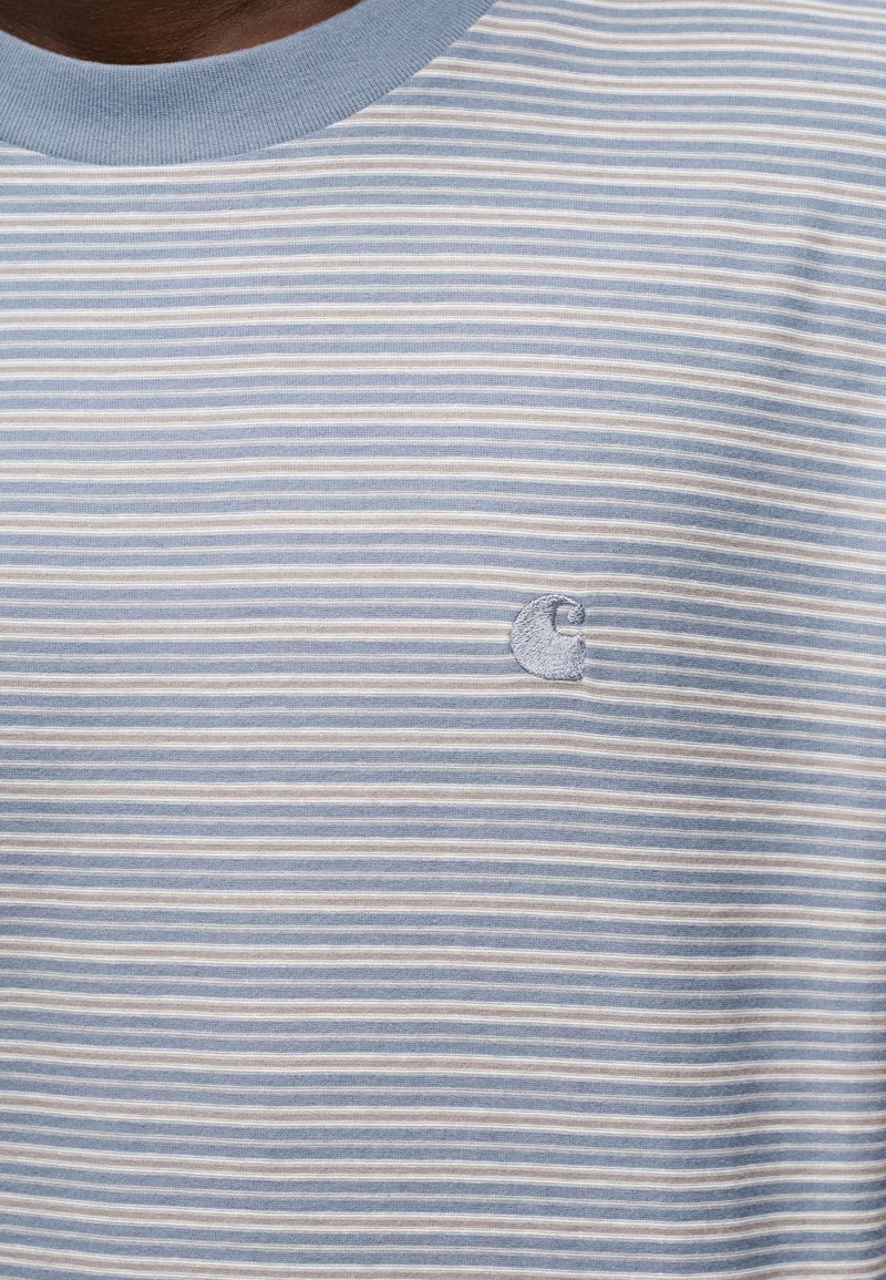 Light blue and white striped short-sleeve shirt with a round neck and small embroidered logo on the chest. Soft cotton material.