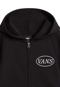 Felpa con zip nera con logo "VANS" bianco. Realizzata in tessuto morbido con una texture liscia e un cappuccio strutturato.