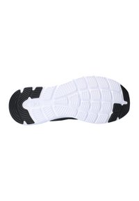Suela de zapato con una sección de goma negra en el talón que transiciona a blanca, con surcos y patrones texturizados para tracción.