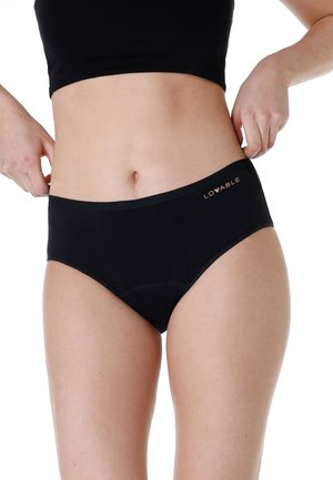 Slipping bikini in cotone nero con un girovita liscio. Presenta un logo sottile in rame e un design senza cuciture per il massimo comfort.