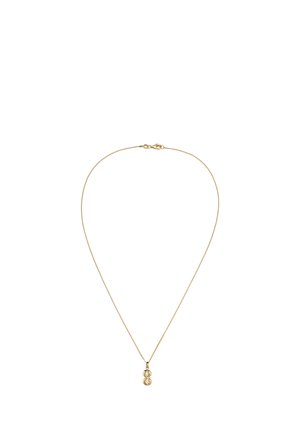 Collier délicat en chaîne d’or avec un petit pendentif représentant deux formes circulaires entrecroisées sur fond blanc.