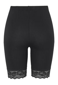 Svarta knälånga shorts i stretchigt tyg med en delikat spetskant nertill. Elastisk midja för en bekväm passform.