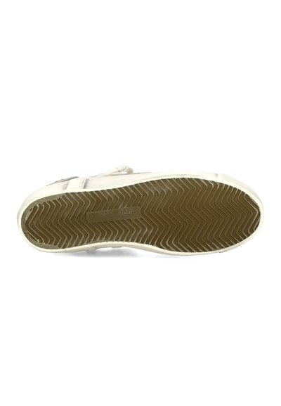 Suela de zapatilla blanca con un patrón de dibujo en zigzag marrón y una etiqueta rectangular de la marca que dice "PHILIPPE MODEL PARIS" en el centro.