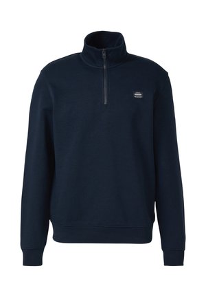 Marineblauer Pullover mit Viertel-Reißverschluss, langen Ärmeln und einem kleinen rechteckigen Logo-Patch auf der linken Brust.
