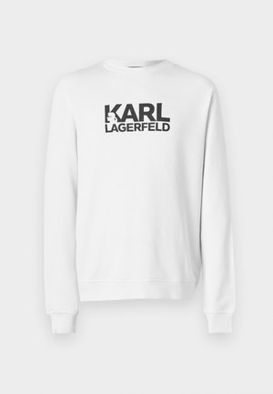 Biela mikina s veľkým čiernym logom "KARL LAGERFELD" na prednej strane. Klasický okrúhly výstrih, rebrované manžety a lem. Bavlnený materiál.