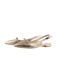 Metallic gold slingback shoes with a pointed toe, flat heel, and small bow accent on the strap. Smooth texture and sleek design.