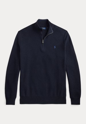Tumesinine pika varrukaga kootud pullover kvart tõmblukuga kraega ja väike tikitud logo vasakul rinnal.