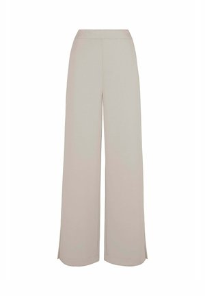 Pantaloni larghi color beige chiaro con elastico in vita, texture morbida e spacchi all'orlo per una maggiore libertà di movimento. Design casual e confortevole.