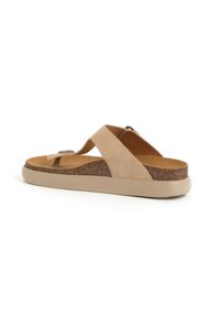Infradito beige con tomaia in suede, soletta in sughero e suola in gomma. Presenta un design con cinturini incrociati e punta arrotondata.