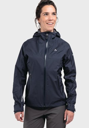 Navy waterproof jacket with a hood, zip front, and two side pockets. Features a smooth texture and logo on the sleeve.