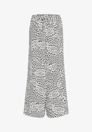 Fekete-fehér leopárdmintás rövidnadrág. Könnyű anyag, rugalmas derékpánt, húzózsinórral. Laza szabás, térdig érő kialakítás.