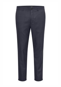 Mörkblå byxor i vävt tyg, med ett subtilt rutmönster, framfickor och en upplåst fåll vid bensluten.