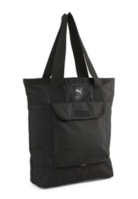 Sac cabas en tissu noir avec bretelles doubles, poche avant à rabat et petit patch logo portant la mention Sports Wear.