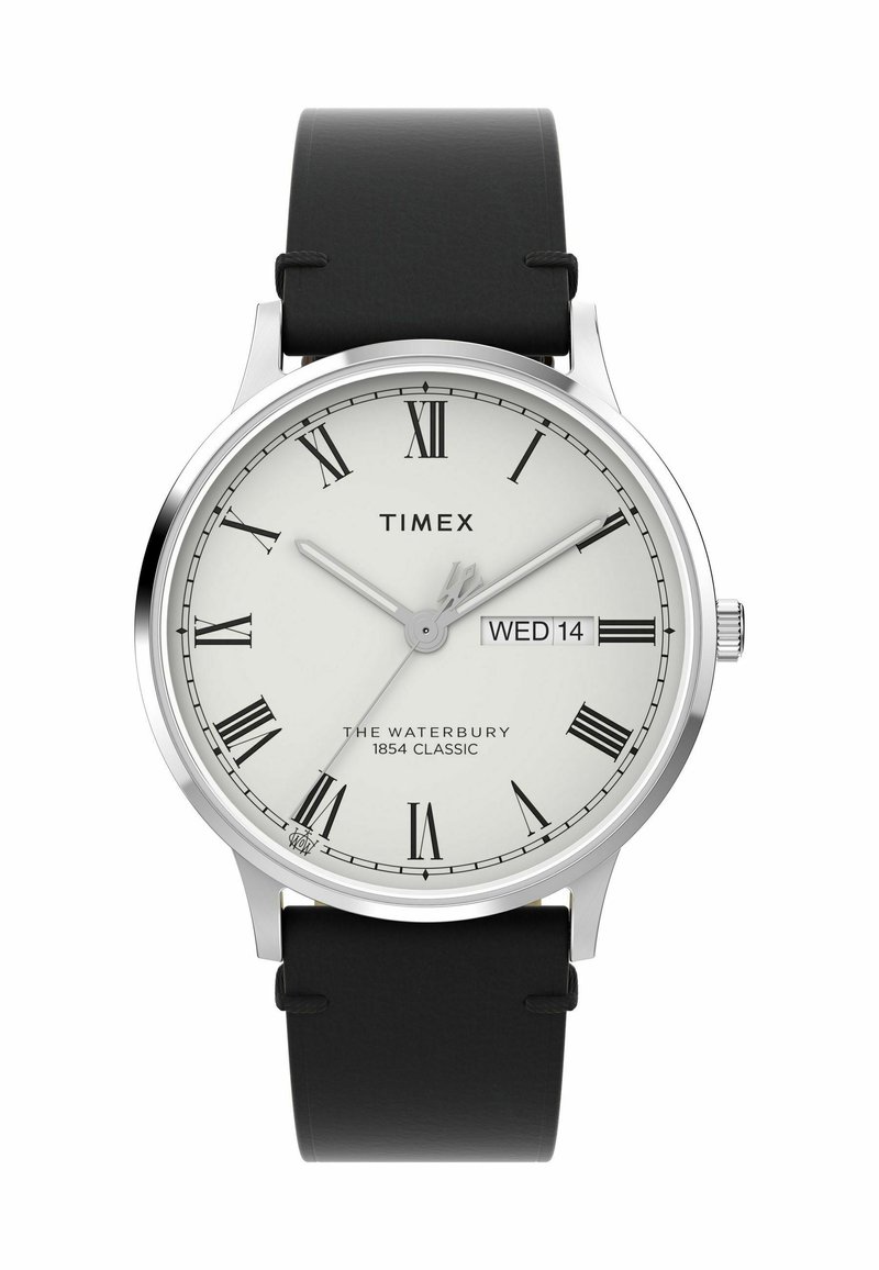 Timex Waterbury watch features a round silver stainless steel case, white dial with Roman numerals, black leather strap, and date display.
