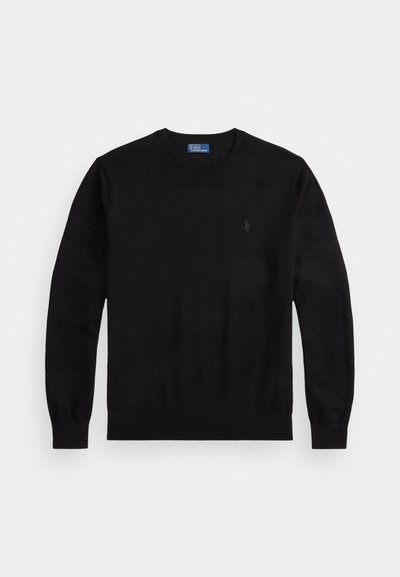 Black sweater with round neckline, long sleeves, and ribbed cuffs. Made of a soft material, featuring a small logo on the left chest.