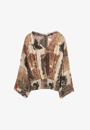 Luźna bluzka w kolorze kremowym z mieszanym wzorem w czerwone, czarne i brązowe akcenty. Posiada dekolt w serek oraz elastyczne marszczenie u dołu.