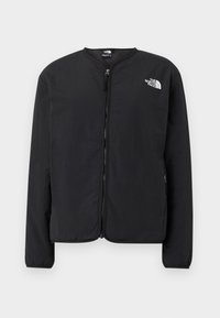 Veste noire zippée à manches longues et col rond, avec le logo The North Face sur la partie gauche supérieure de la poitrine sur un fond uni.
