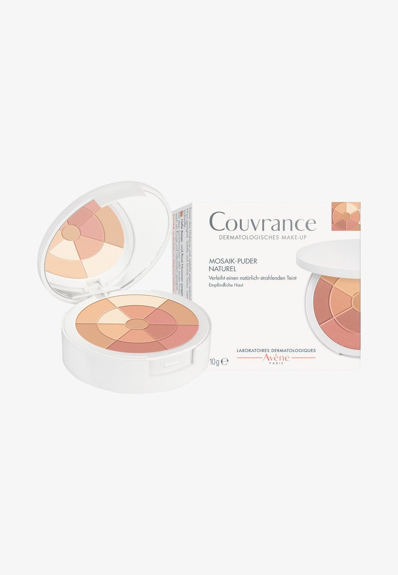 Mosaic powder compact with four color segments: light cream, peach, beige, and coral. Round shape, housed in a white container with a mirror.