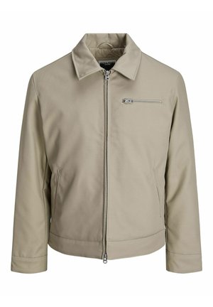 Beige jacka i slätt tyg, med krage, framzipper och en bröstficka med zippersnörning.