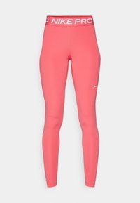Nike Pro legging in fel korenrood, met een brede witte logo-elastische tailleband en een gladde, nauwsluitende pasvorm die naar de enkel toe versmalt.