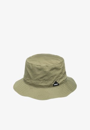 Olive green bucket hat made of lightweight fabric, featuring a wide brim and a triangular black logo patch on the side. Smooth texture.
