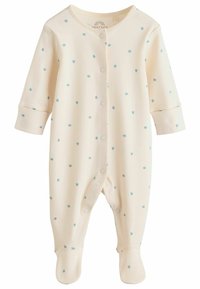 Cremefarbenes Baby-Overall mit langen Ärmeln, der ein Sternmuster in Hellblau zeigt, mit Druckknopfverschluss vorne und Füßchen-Design.
