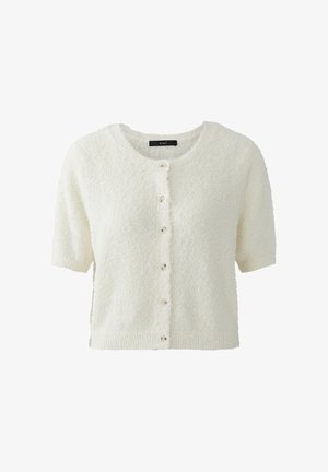 Cardigan texturé à manches courtes de couleur crème avec encolure ronde et boutons à l'avant, étiquette "oui" à l'intérieur du col.