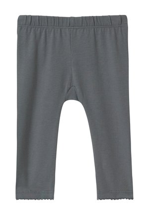 Grijze legging gemaakt van zachte, rekbare stof met een elastische tailleband. Voorzien van een gekartelde zoom bij de enkels en een gladde textuur.
