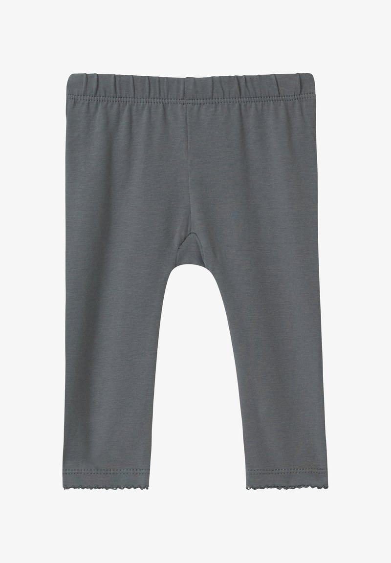 Leggings grigi realizzati in un tessuto morbido e elasticizzato, con una vita elastica. Presentano un orlo a onde alle caviglie e una superficie liscia.