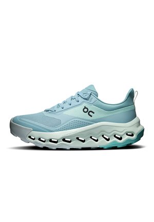 Light blue athletic sneaker with mesh upper, lace closure, ON logo, and thick wavy sole with visible cutouts, viewed from the side.