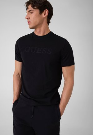 Guess, T-SHIRT MIT GESTICKTEM LOGO - T-shirt imprimé - schwarz