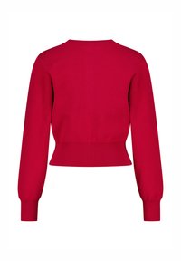 Pull court rouge à manches longues, avec un ourlet et un col côtelés. Texture lisse avec un corps ajusté et des manches bouffantes.