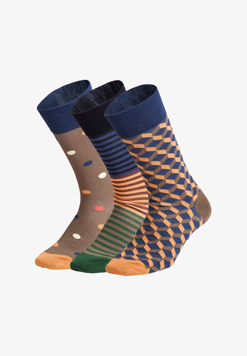 Tre par bomuldsstrømper: venstre i brun med farverige prikker, midten i striber, højre i geometriske orange og blå mønstre.
